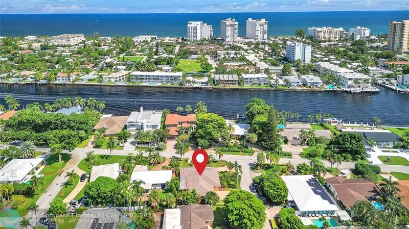 an aerial view of a house with a lake view