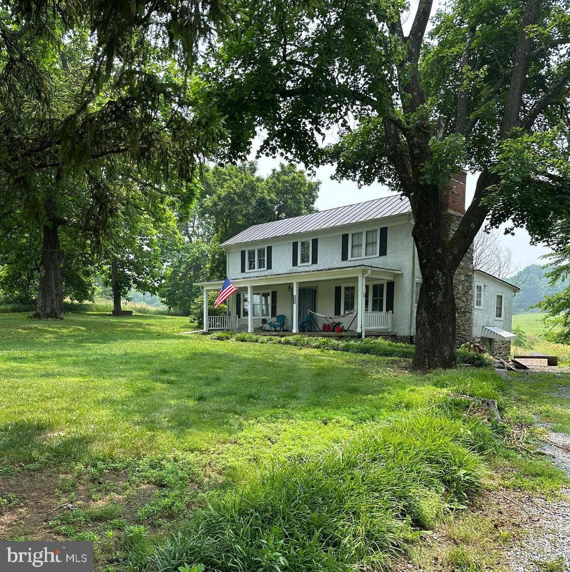 a view of a house with a big yard