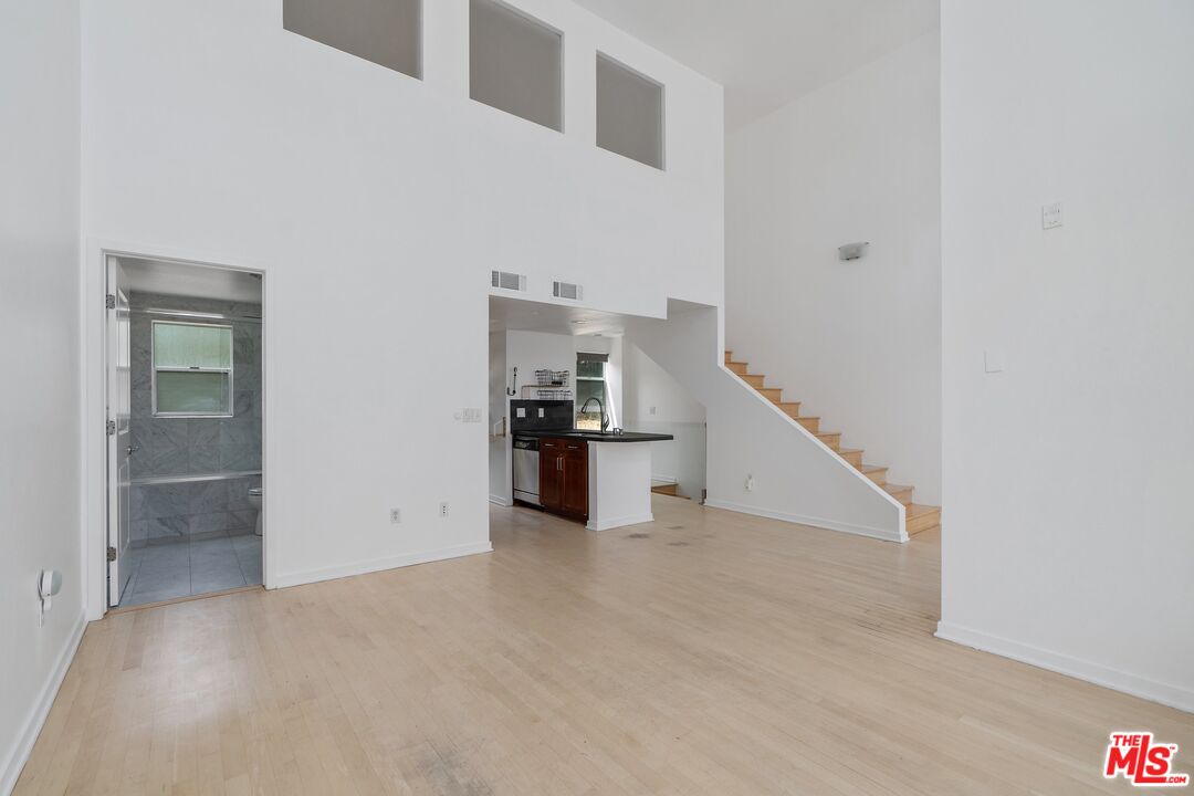 a view of a hallway with staircase