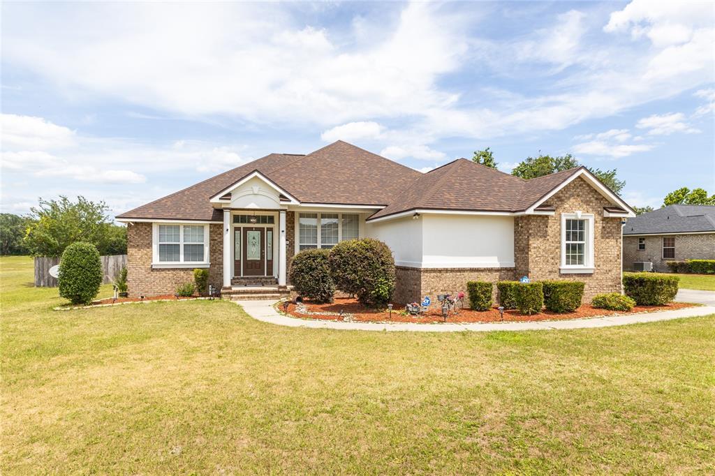 a front view of a house with a yard