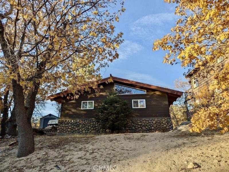 a view of a house with a tree