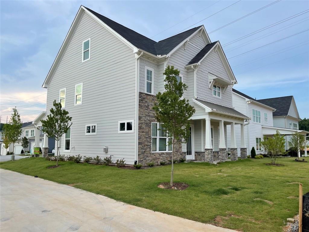 a front view of a house with a garden