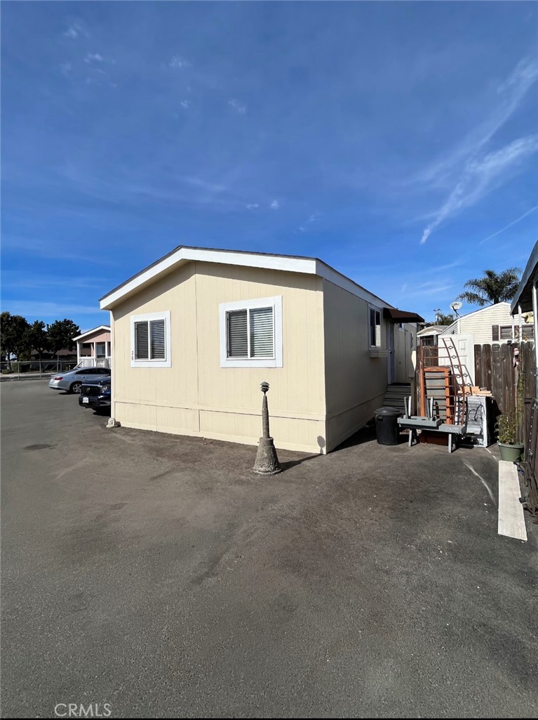 a view of a house with car parked