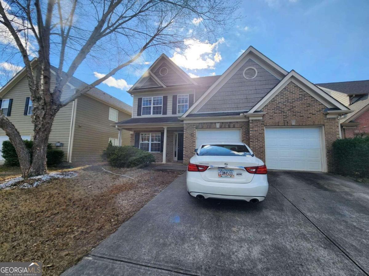 a car parked in front of a house