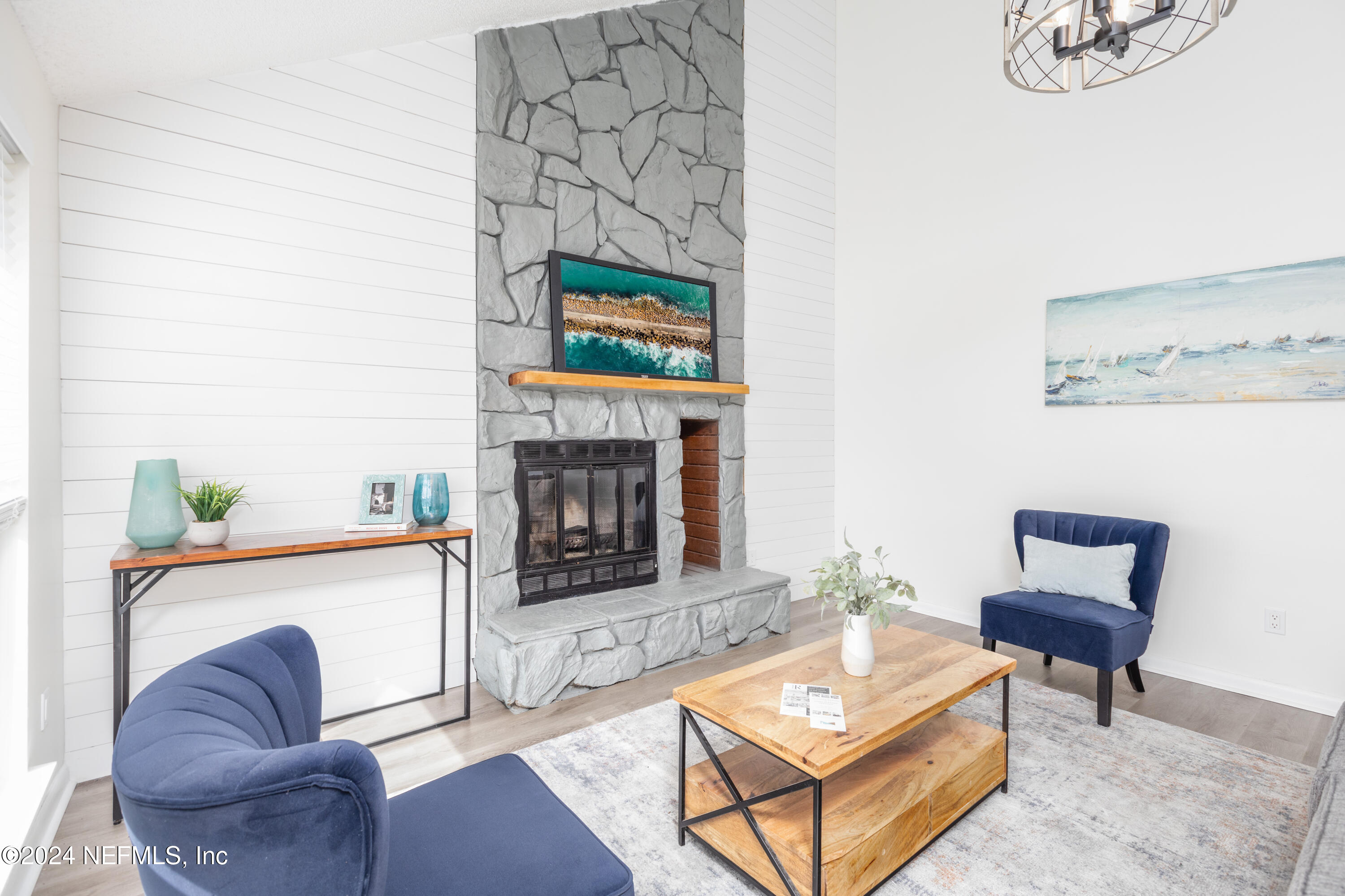 a living room with furniture and a fireplace