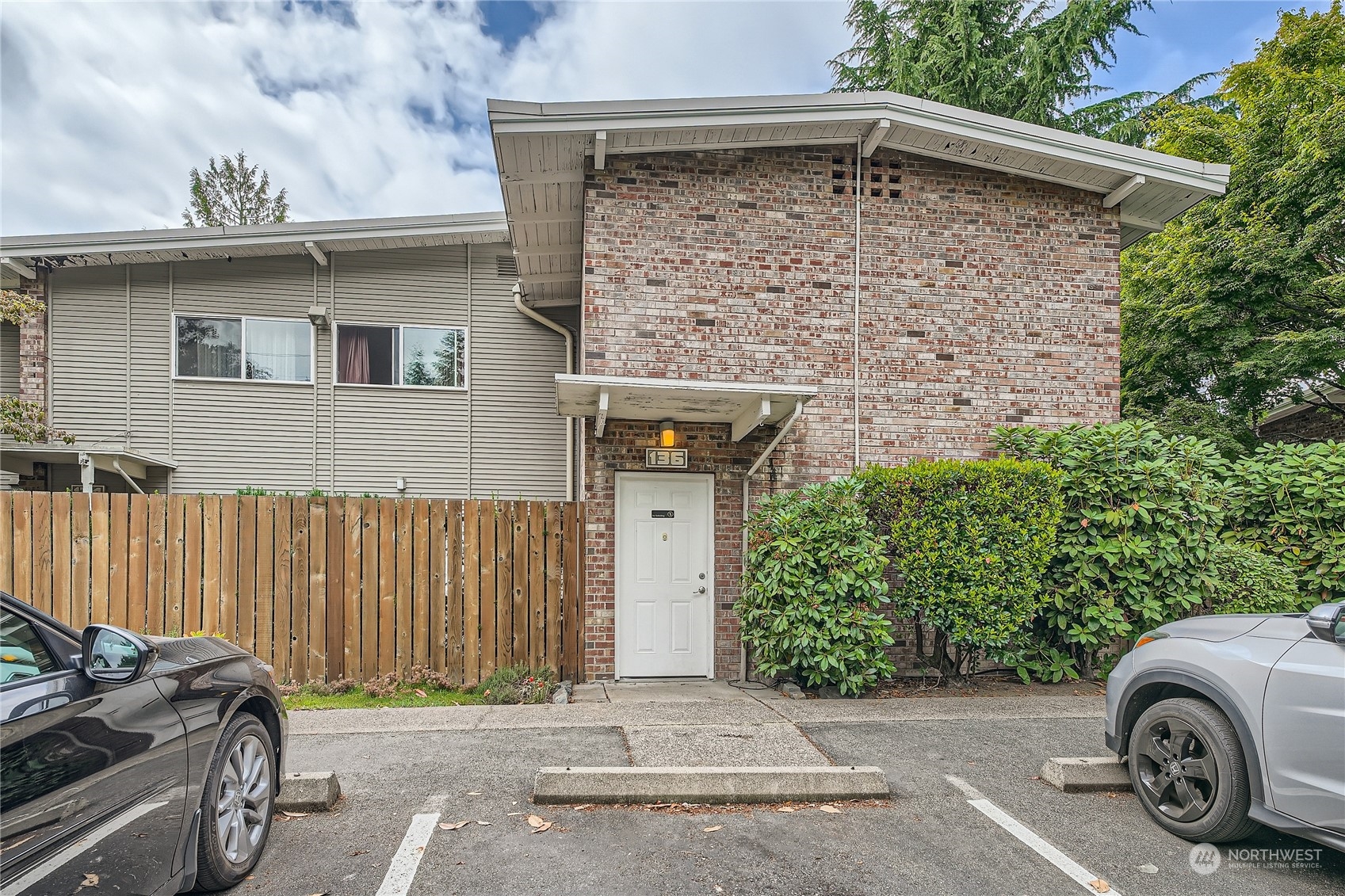 a front view of a house with parking space