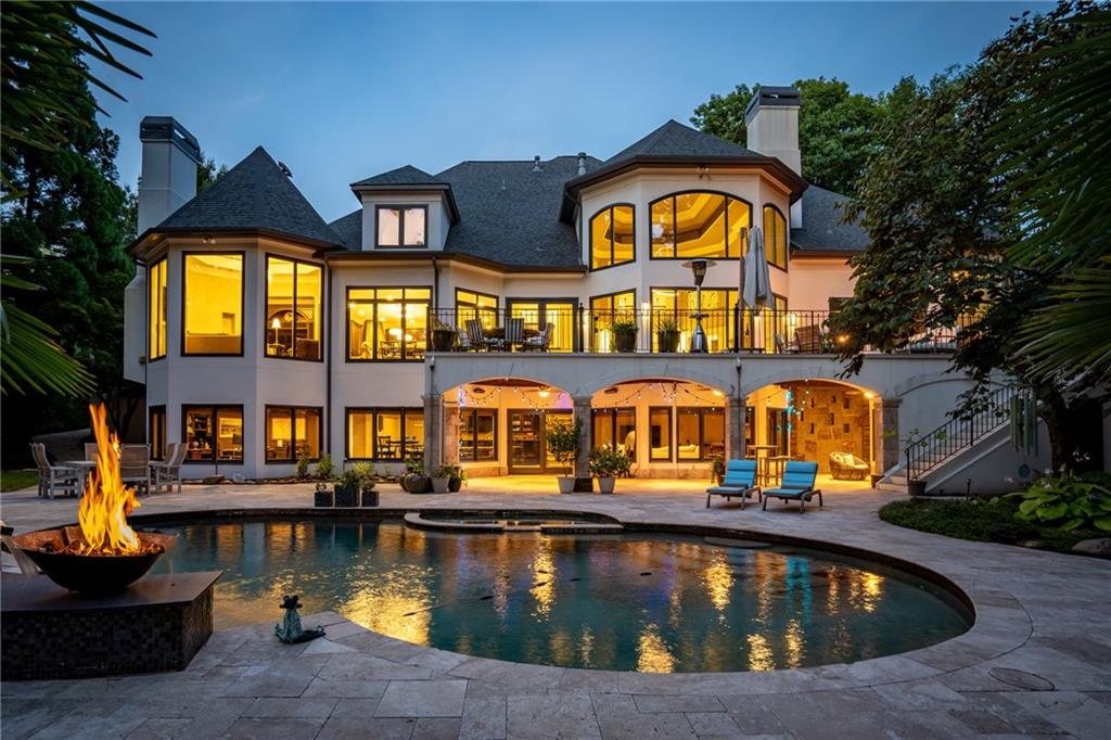 a view of swimming pool with outdoor seating and a yard