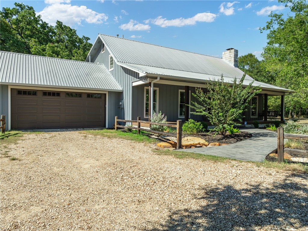 a view of a house with backyard and porch