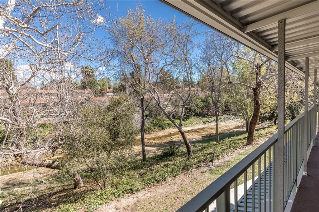 a view of a yard from a balcony