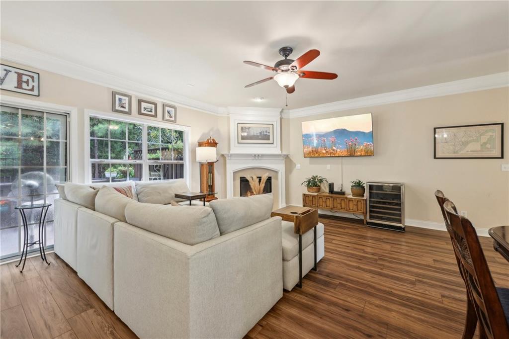 a living room with fireplace furniture and a flat screen tv