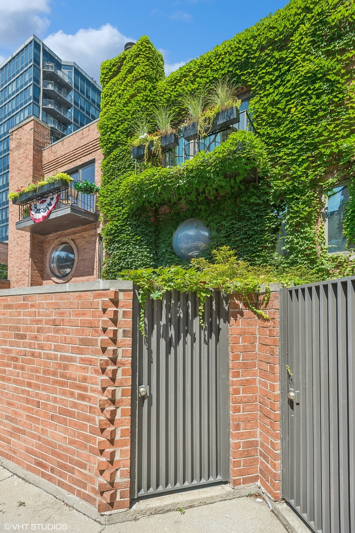 a view of building with wooden fence