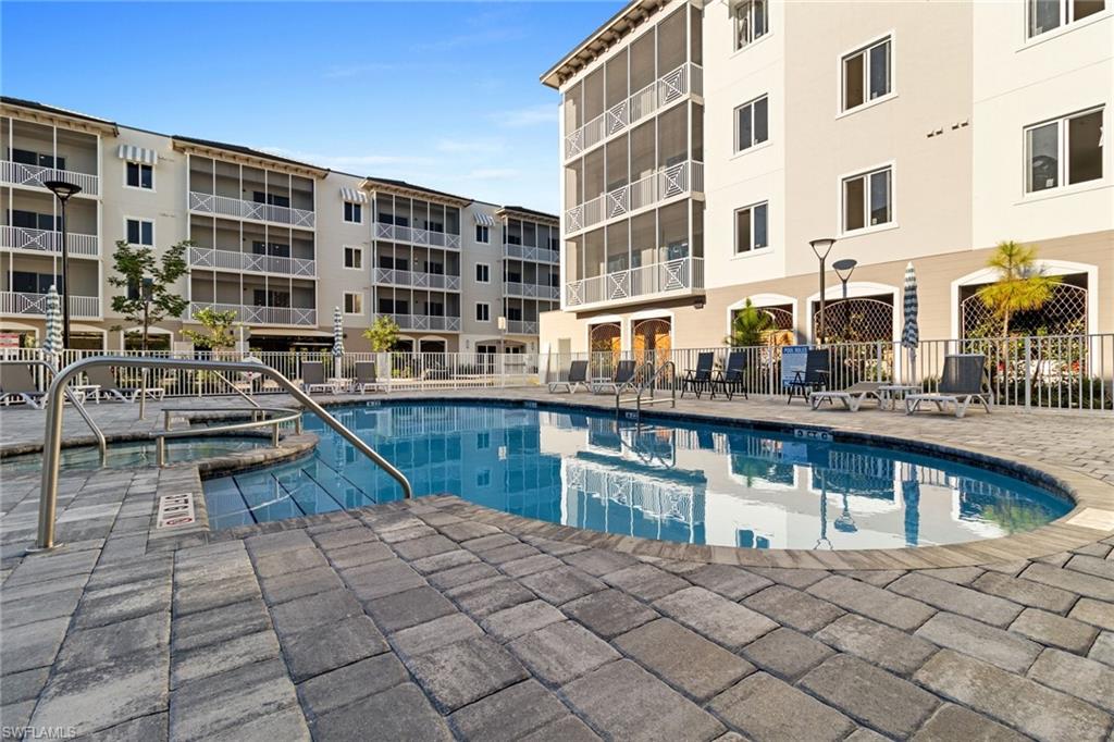 a building view with swimming pool and barbeque oven