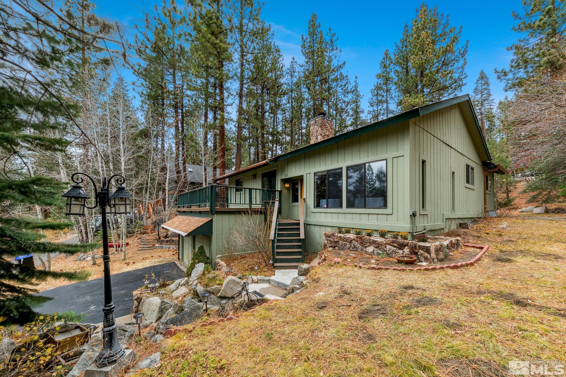 a front view of a house with trees