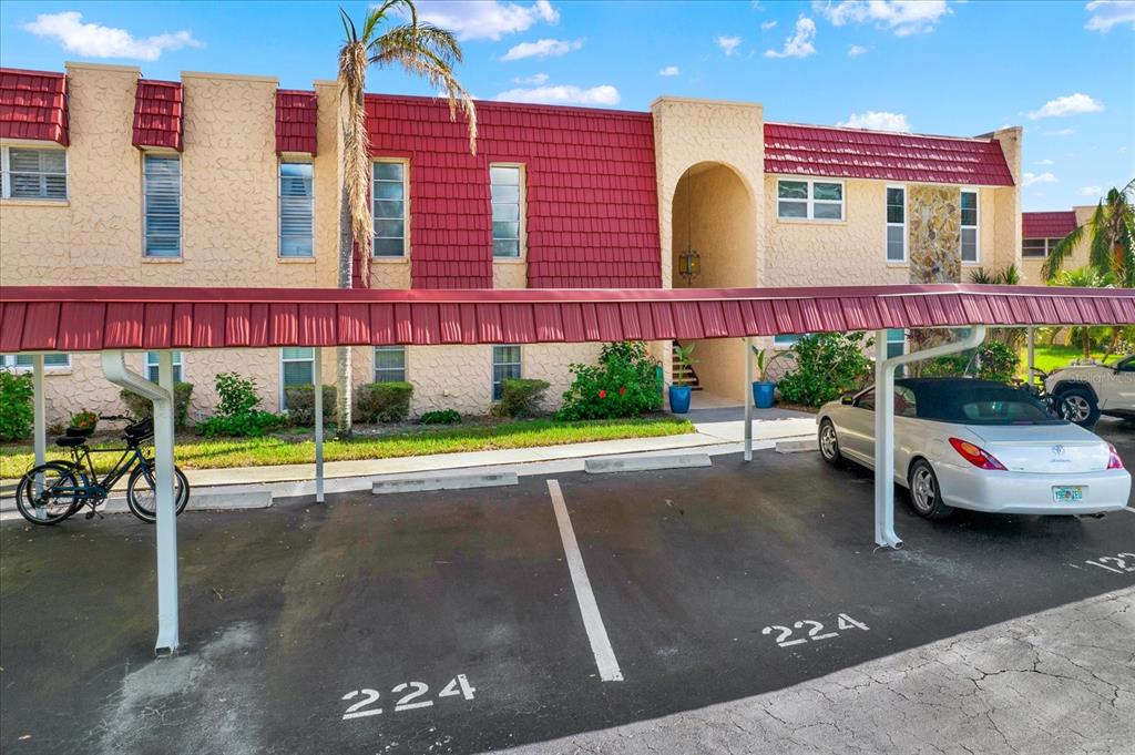 a view of a building with car parked