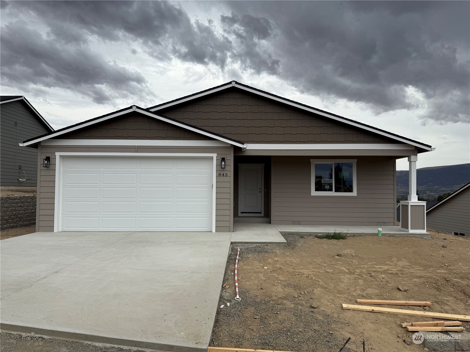 a front view of a house with garage