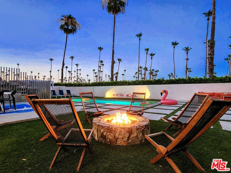 a view of a swimming pool with a lounge chairs