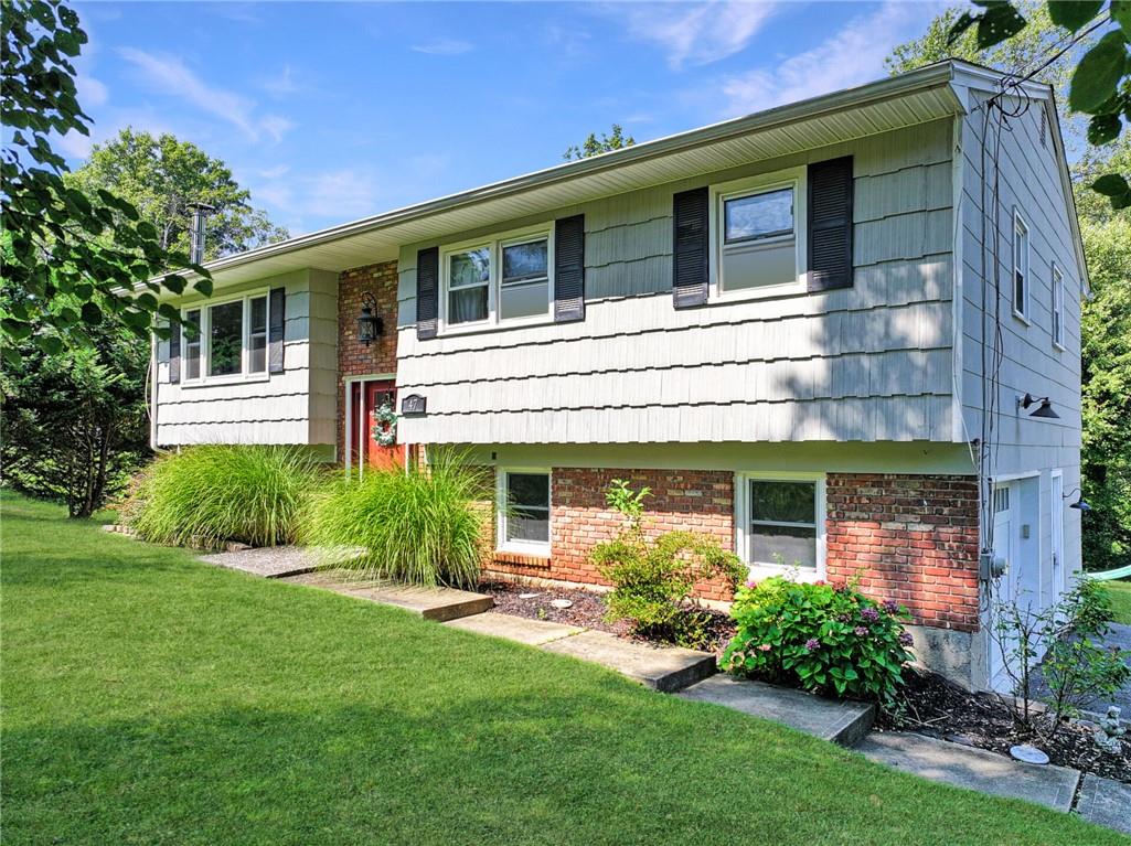 View of front of home featuring a front lawn