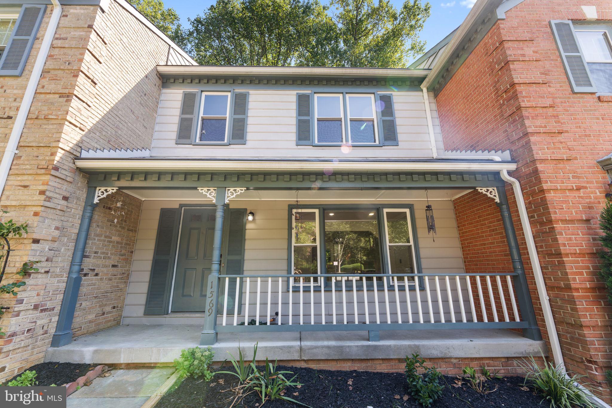 a front view of a house with a porch