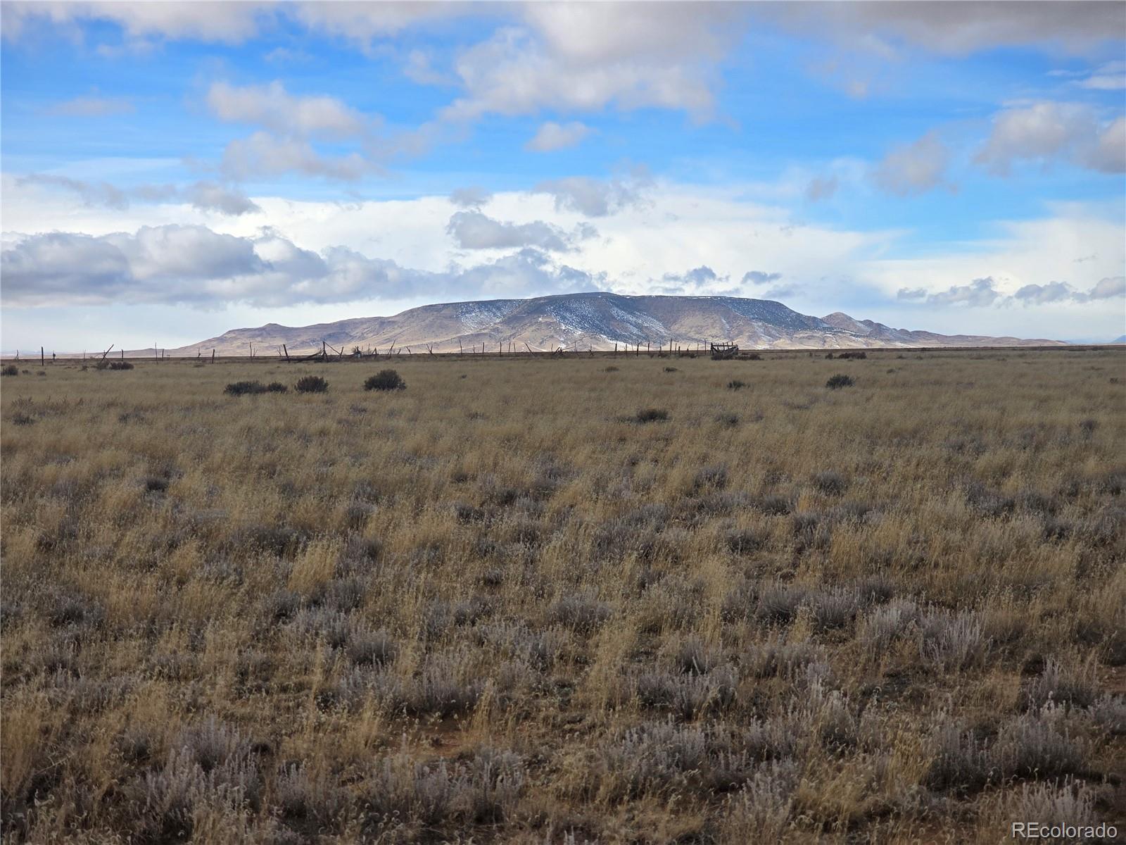 a view of a mountain view with mountains in the background