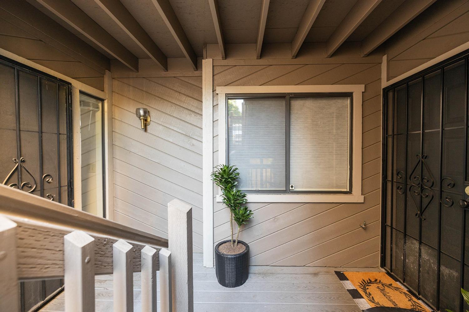 a view of a door and a window