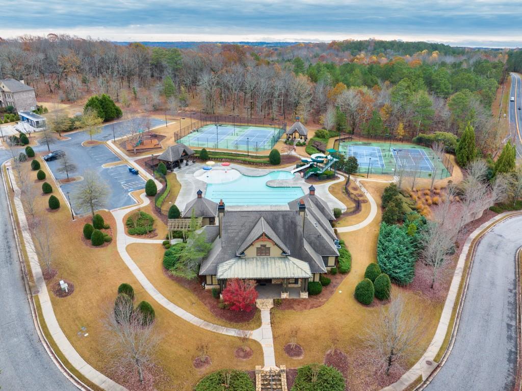 a view of a swimming pool with a yard