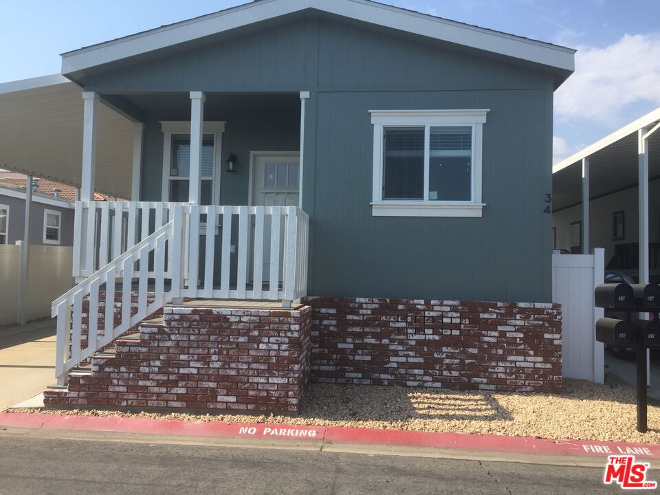 a view of a house with a street