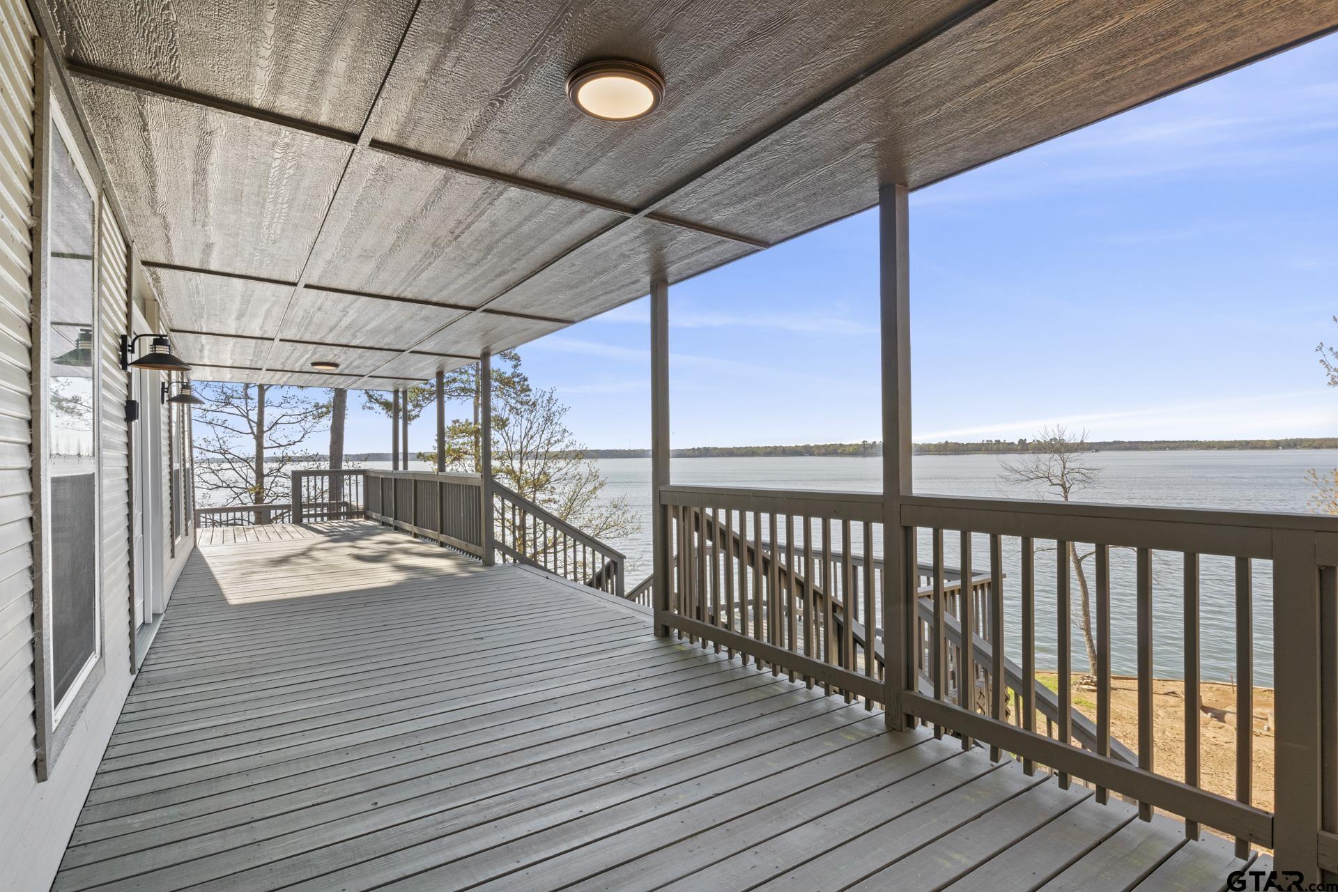 a view of a balcony with wooden floor