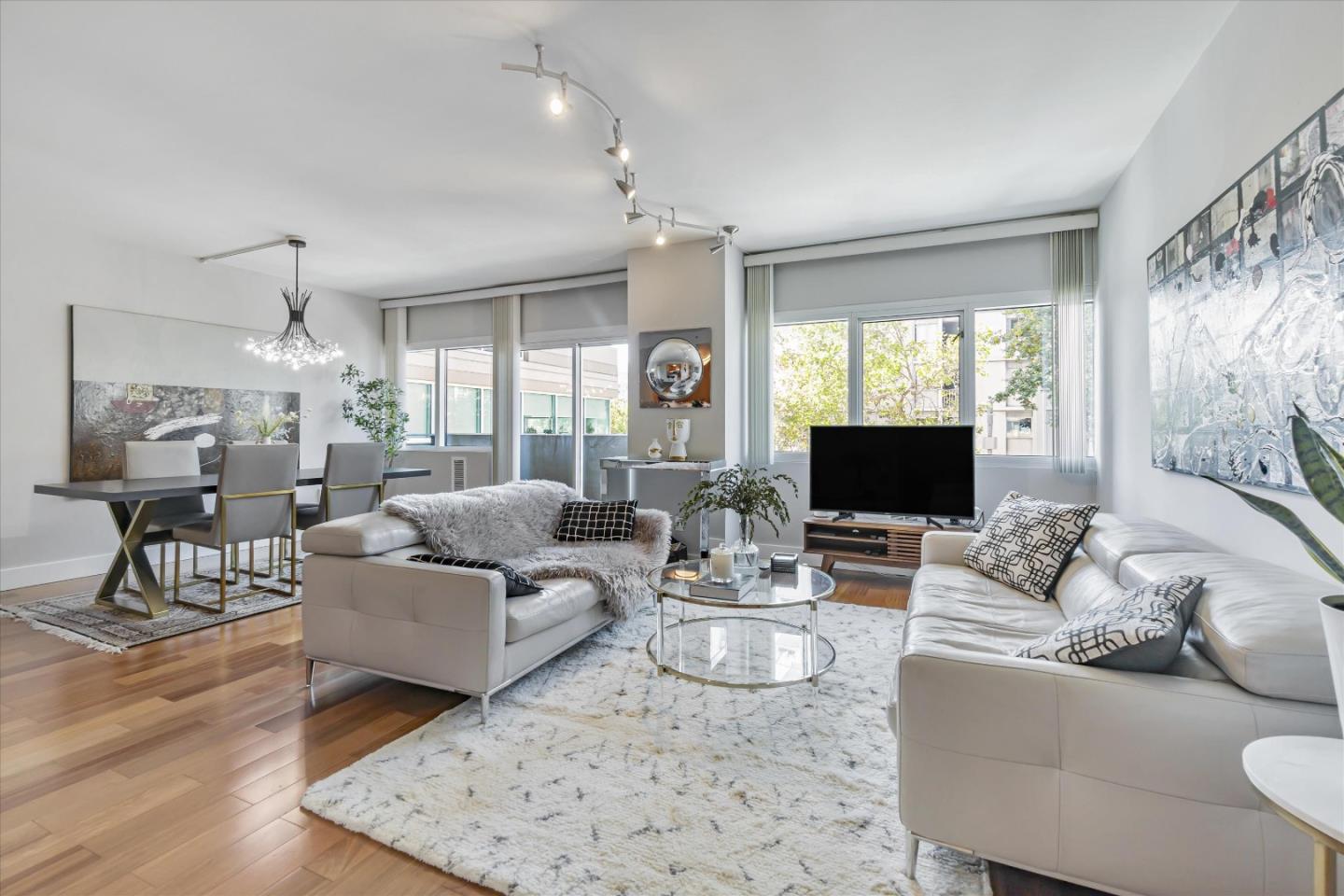 a living room with fireplace furniture and a flat screen tv