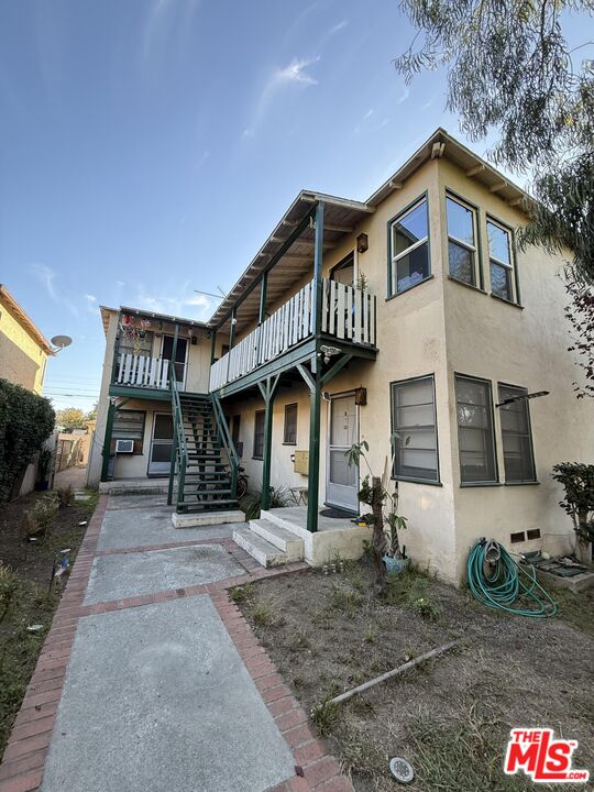 a front view of a house with parking space