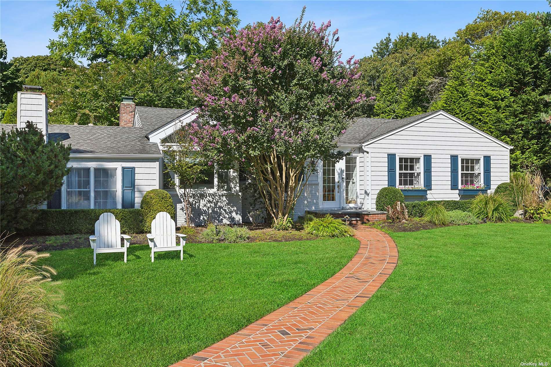 a view of a house with a yard porch and sitting area