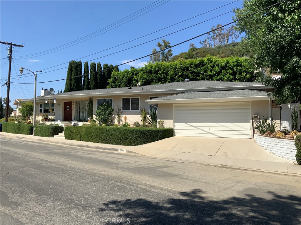 a view of house with outdoor space and street view