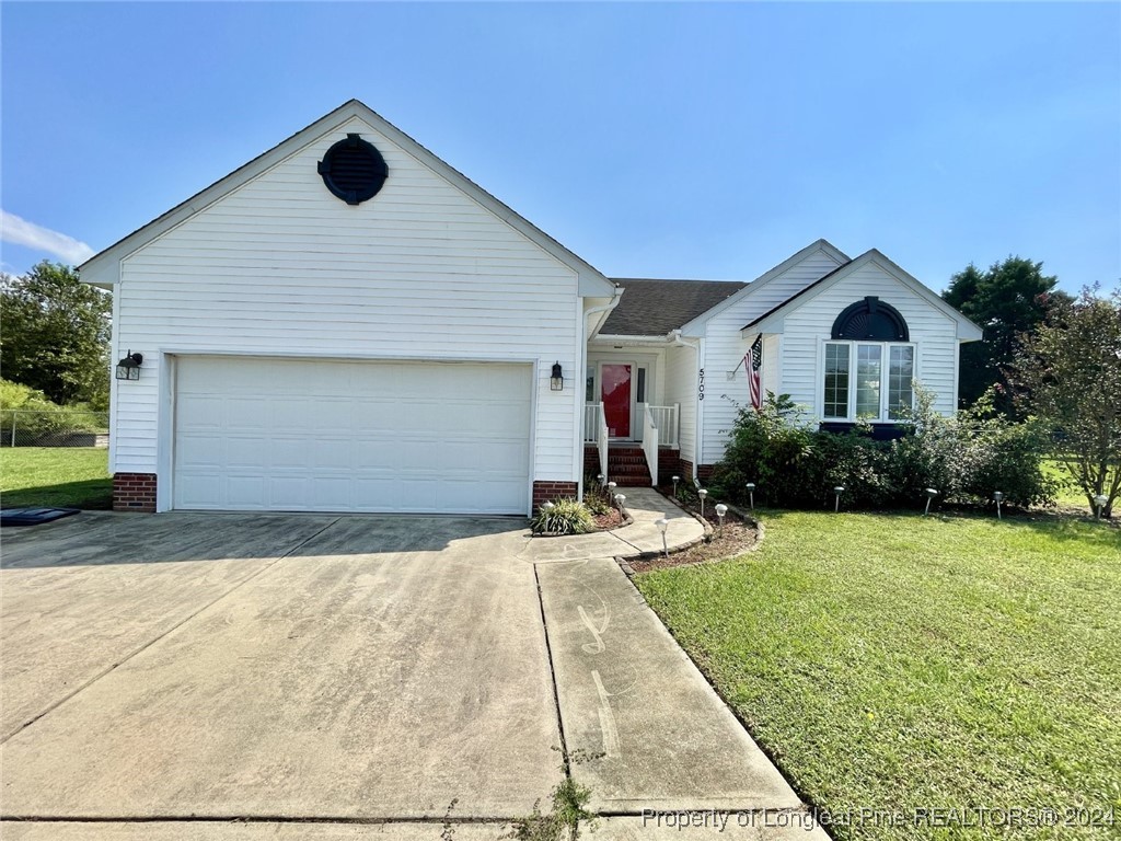 a front view of a house with yard