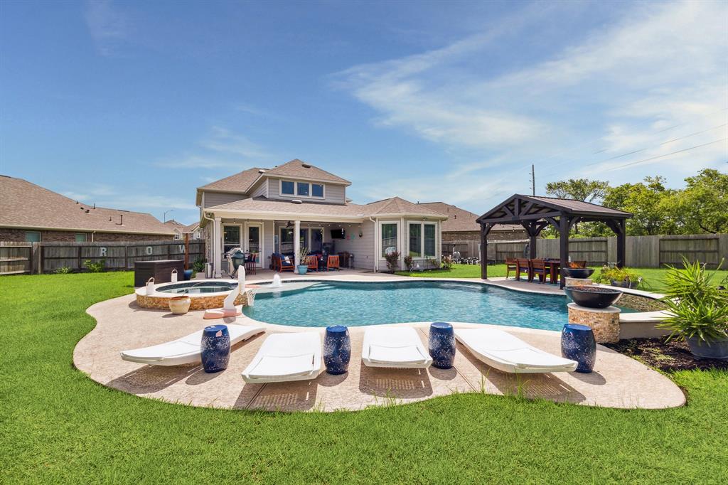 a front view of house with yard and outdoor seating