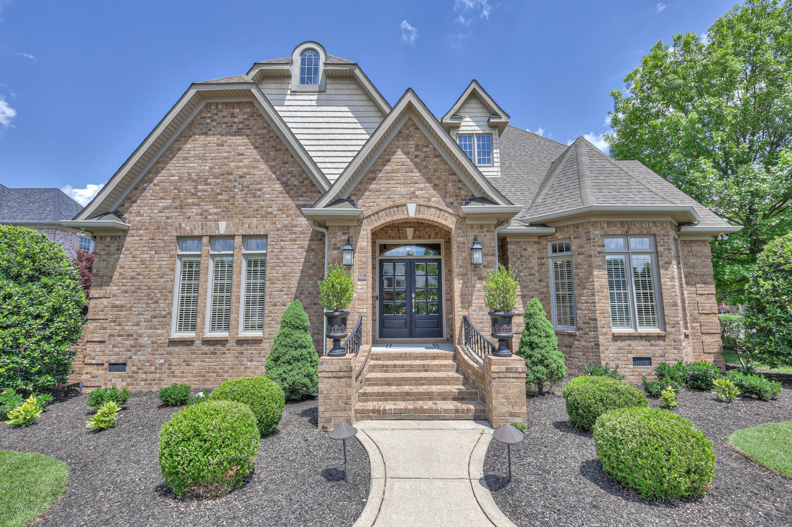 front view of a house with a yard