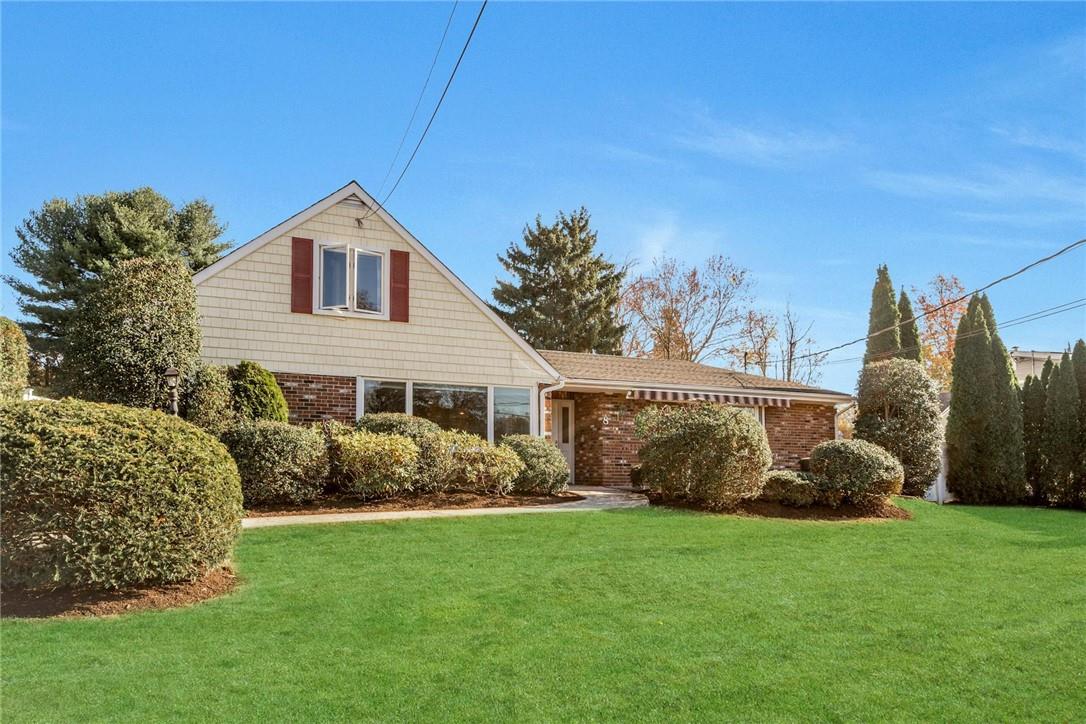 View of front of home featuring a front lawn