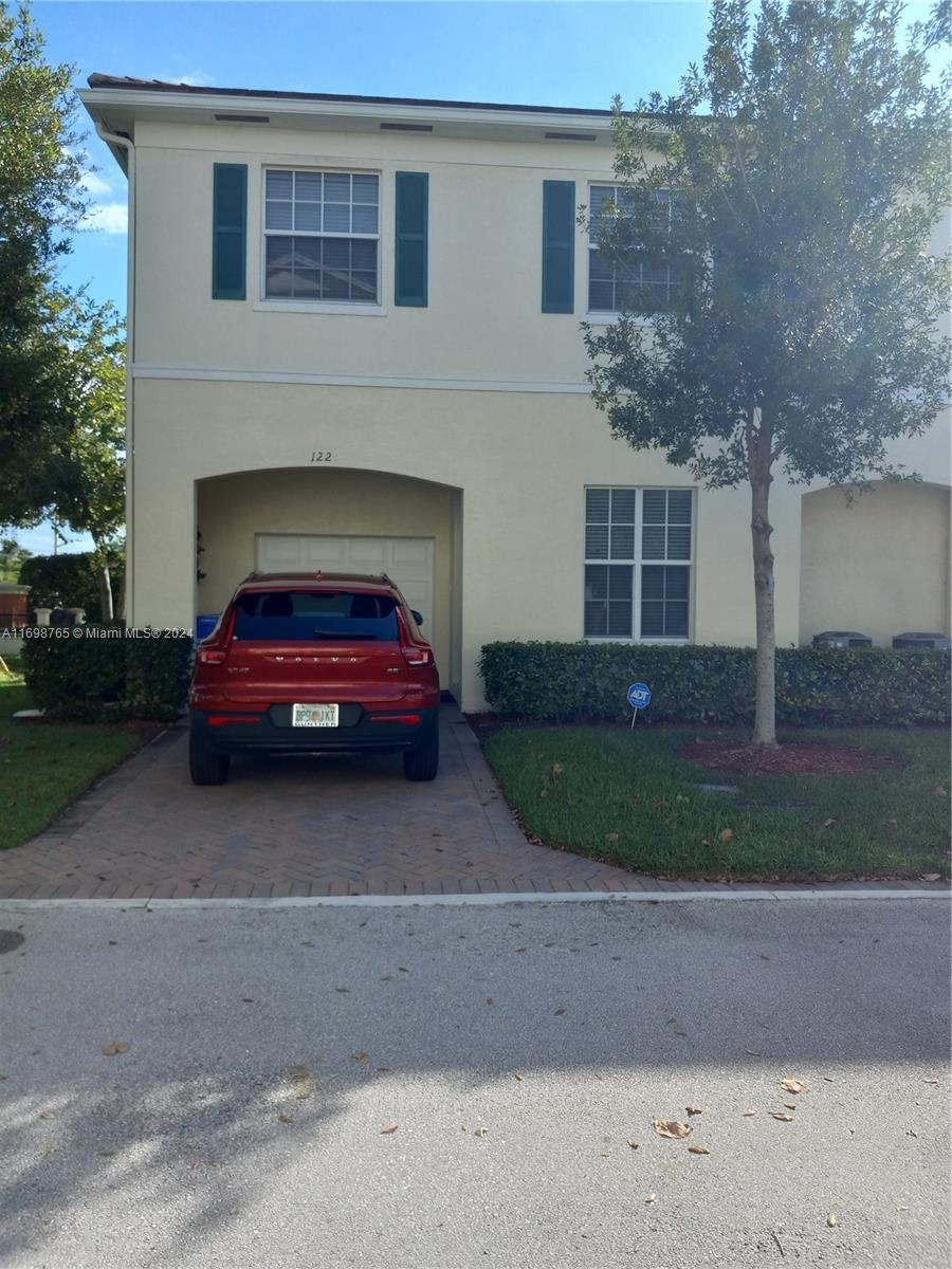 a car parked in front of a house