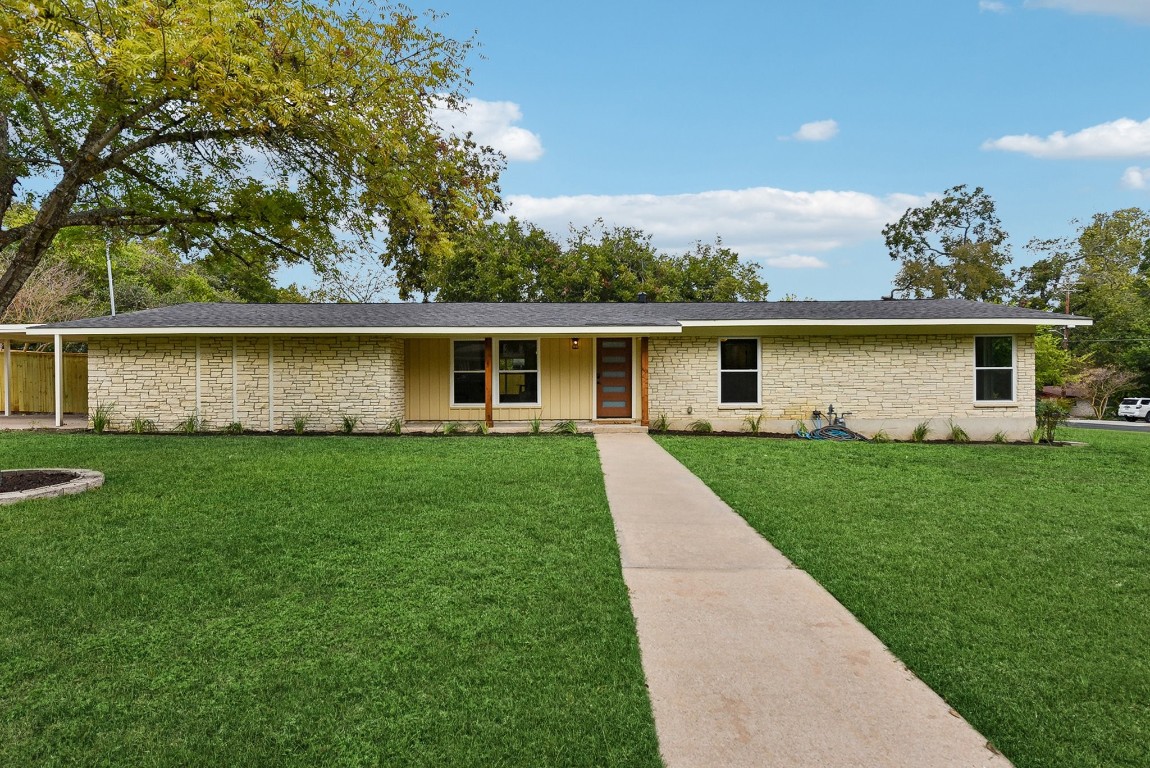 a front view of house with yard and green space