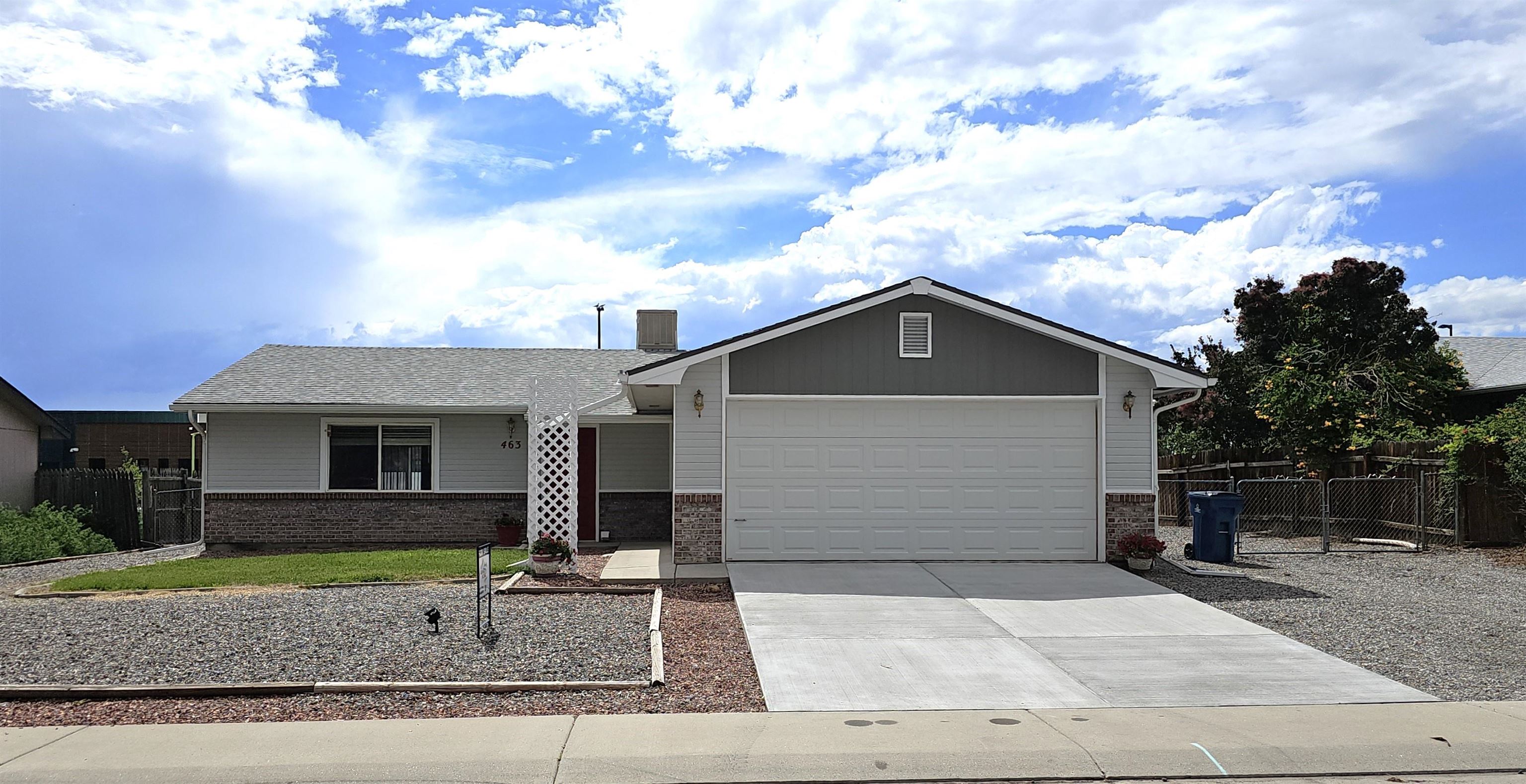 a front view of a house with garage