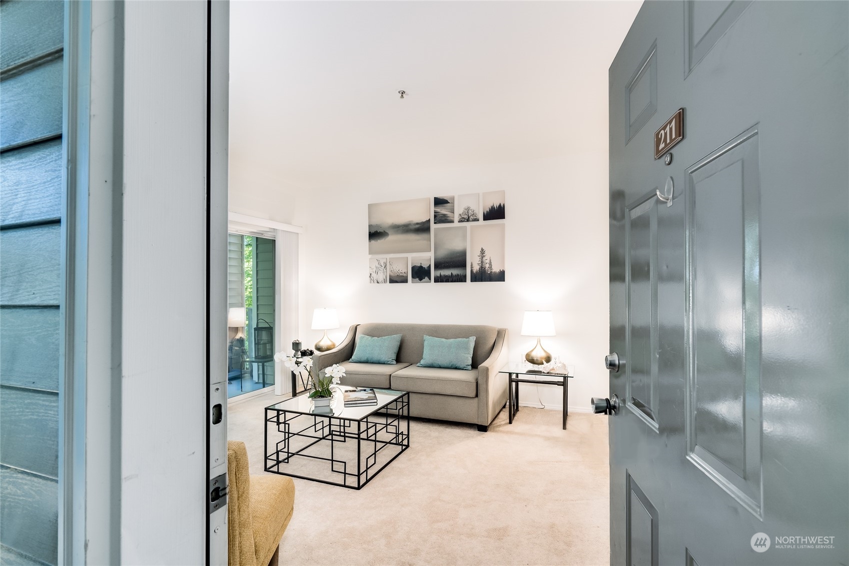 a living room with furniture and a table