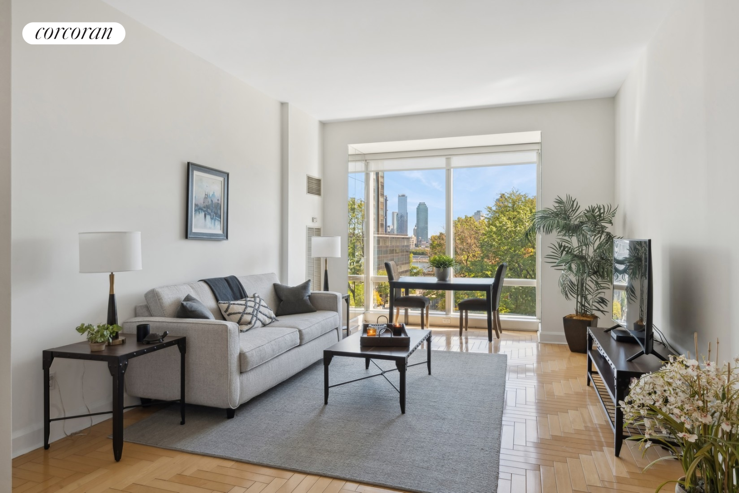 a living room with furniture and a flat screen tv