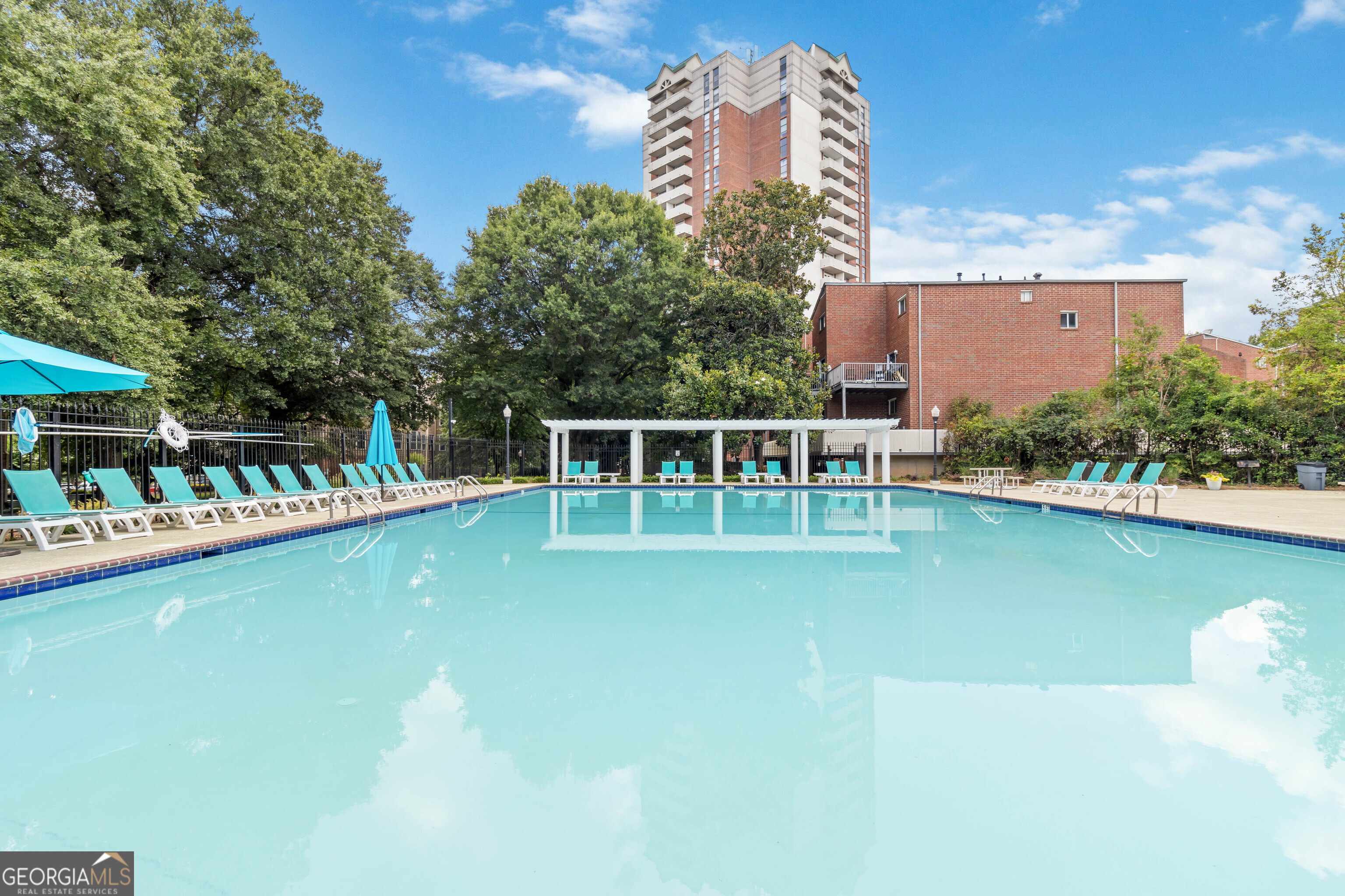 swimming pool view with a lake view