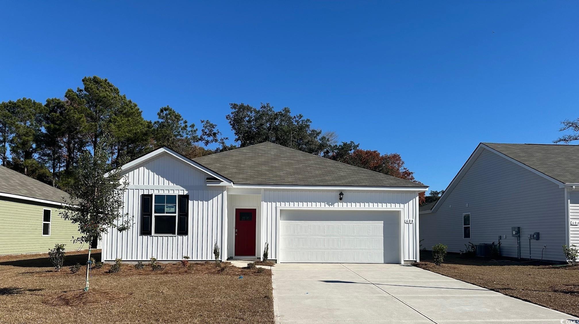 View of front of home featuring a garage