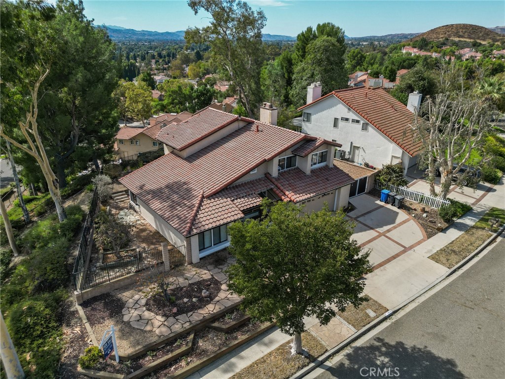 an aerial view of multiple houses with yard