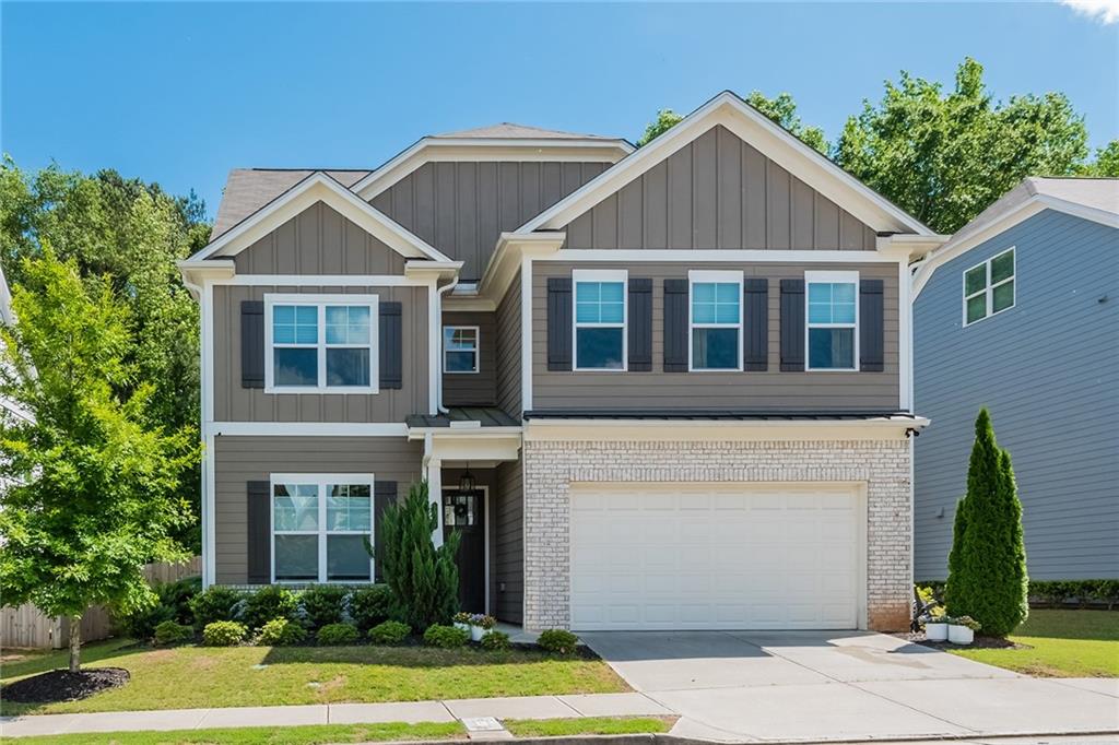 a front view of a house with a yard