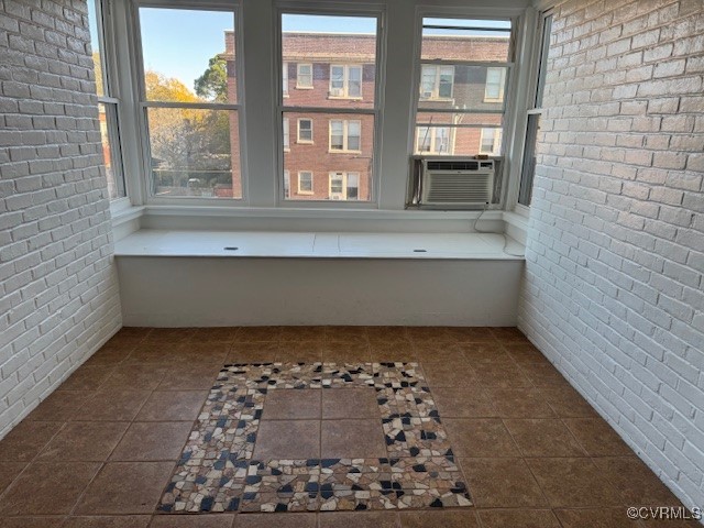 Unfurnished sunroom with cooling unit