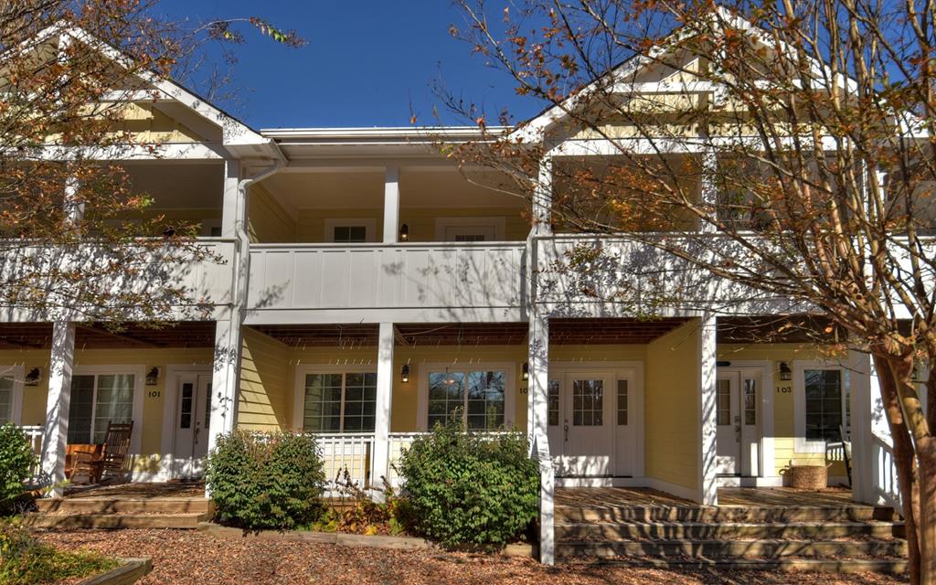 a view of a house with a tree