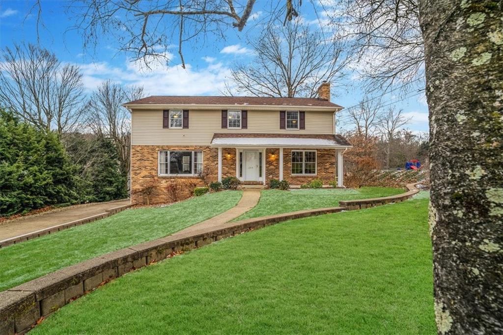 a front view of a house with a yard