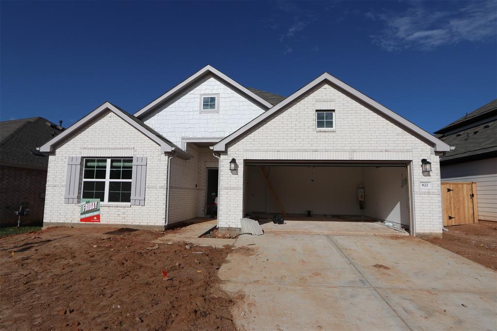 a front view of a house with a garage and a garage