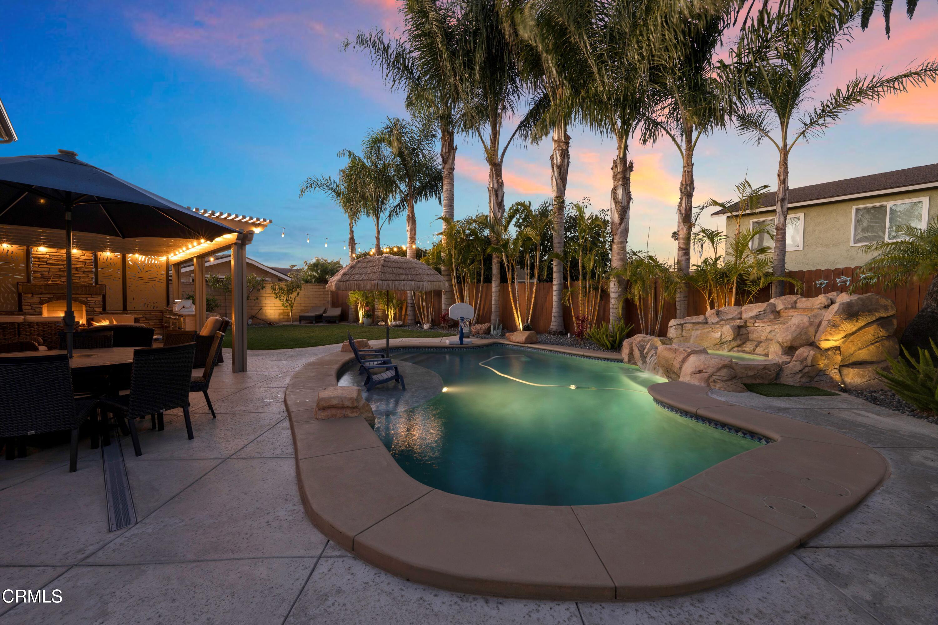 a view of outdoor space with seating area and barbeque oven