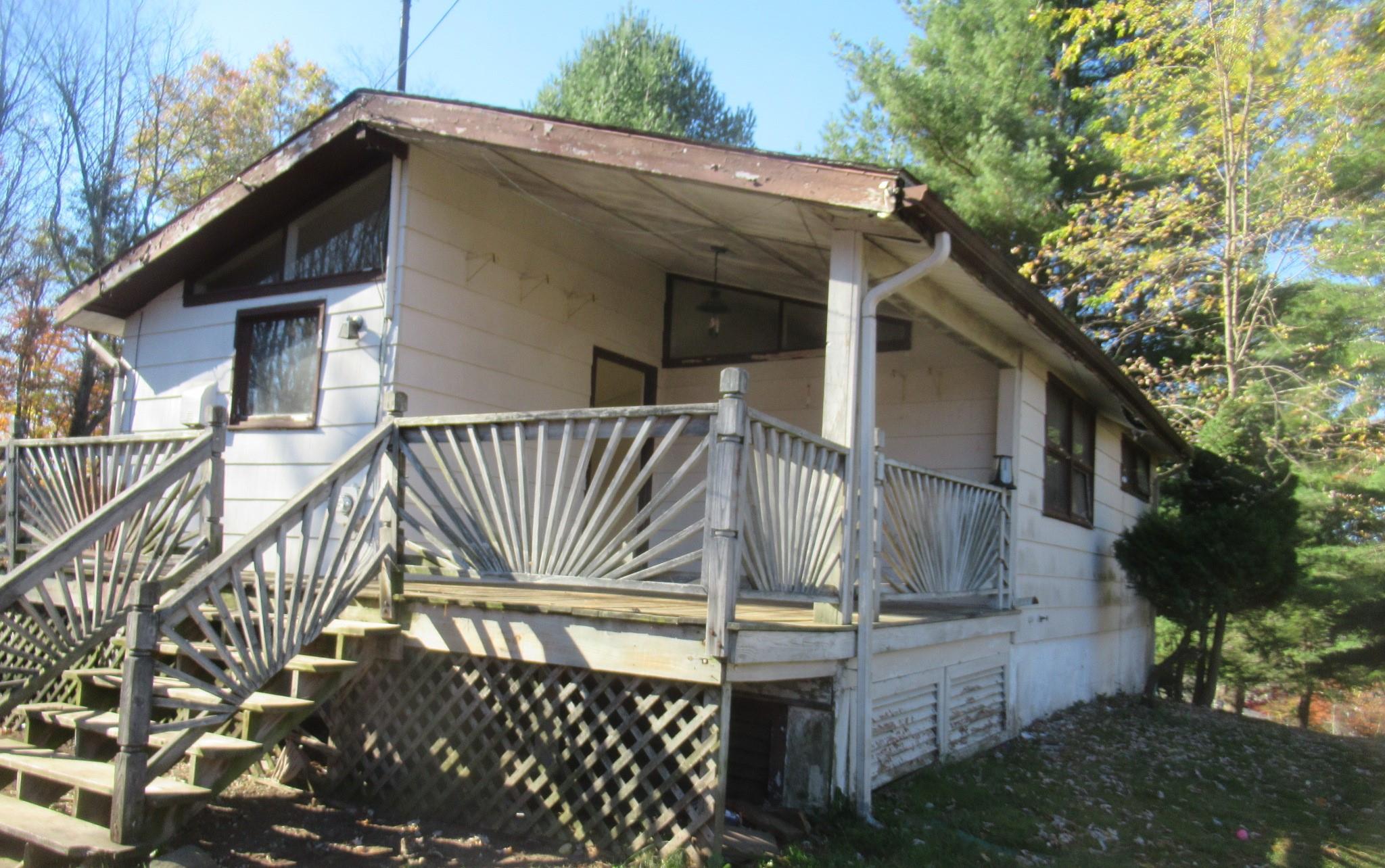 View of home's exterior featuring a deck